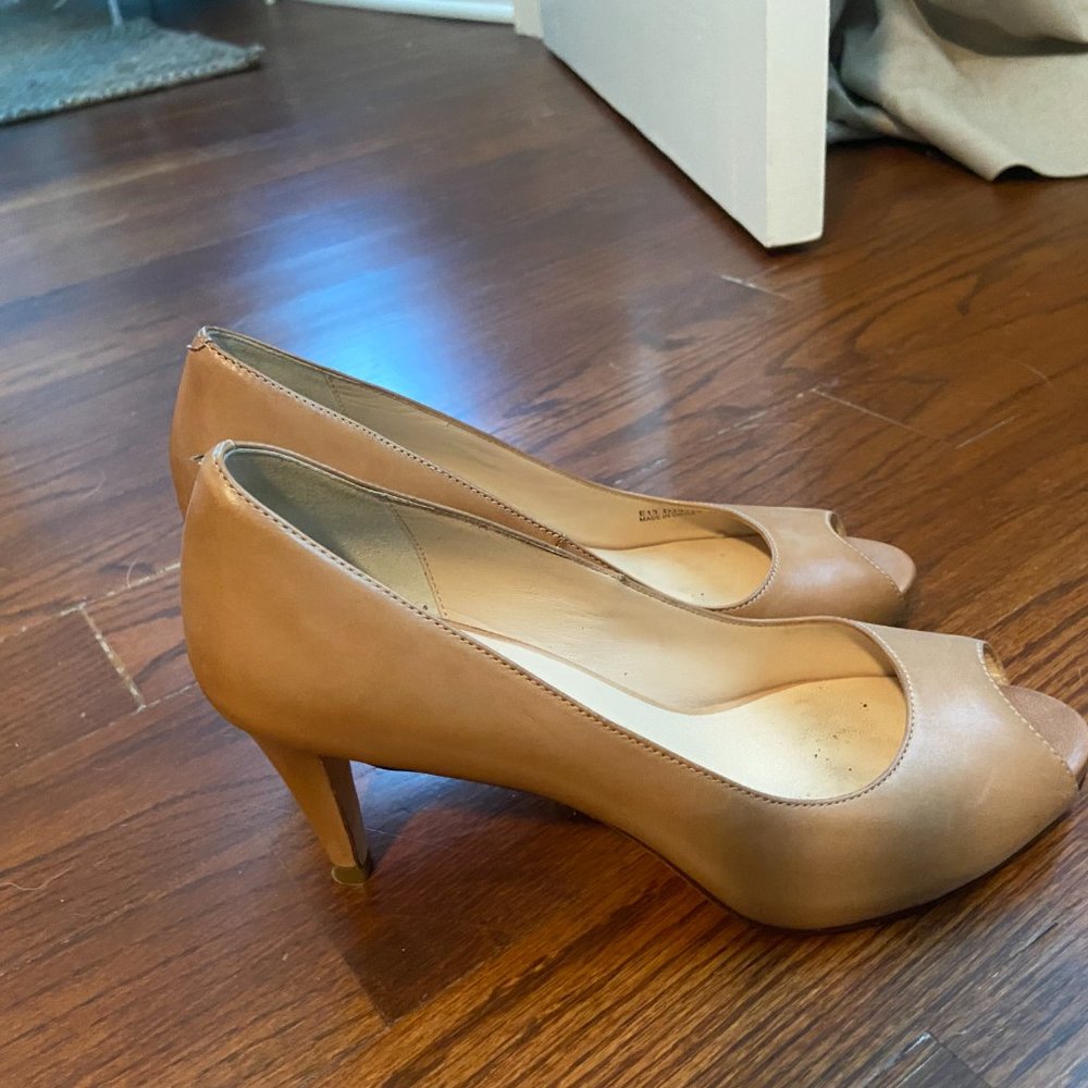 Cole Haan peep toe pump in beige leather.